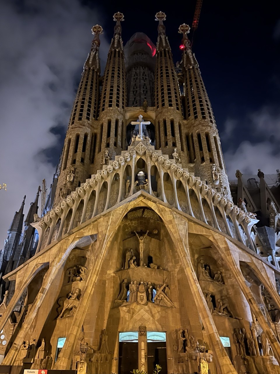 Sagrada Família Passion façade lit at night